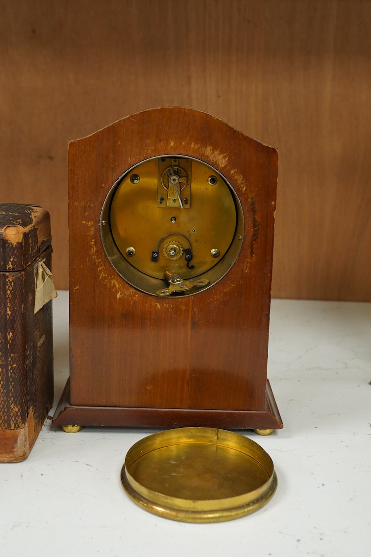 A late 19th century lacquered brass repeating carriage clock, by Henri Jacot and an Edwardian inlaid mantel timepiece with key, largest 23cm high